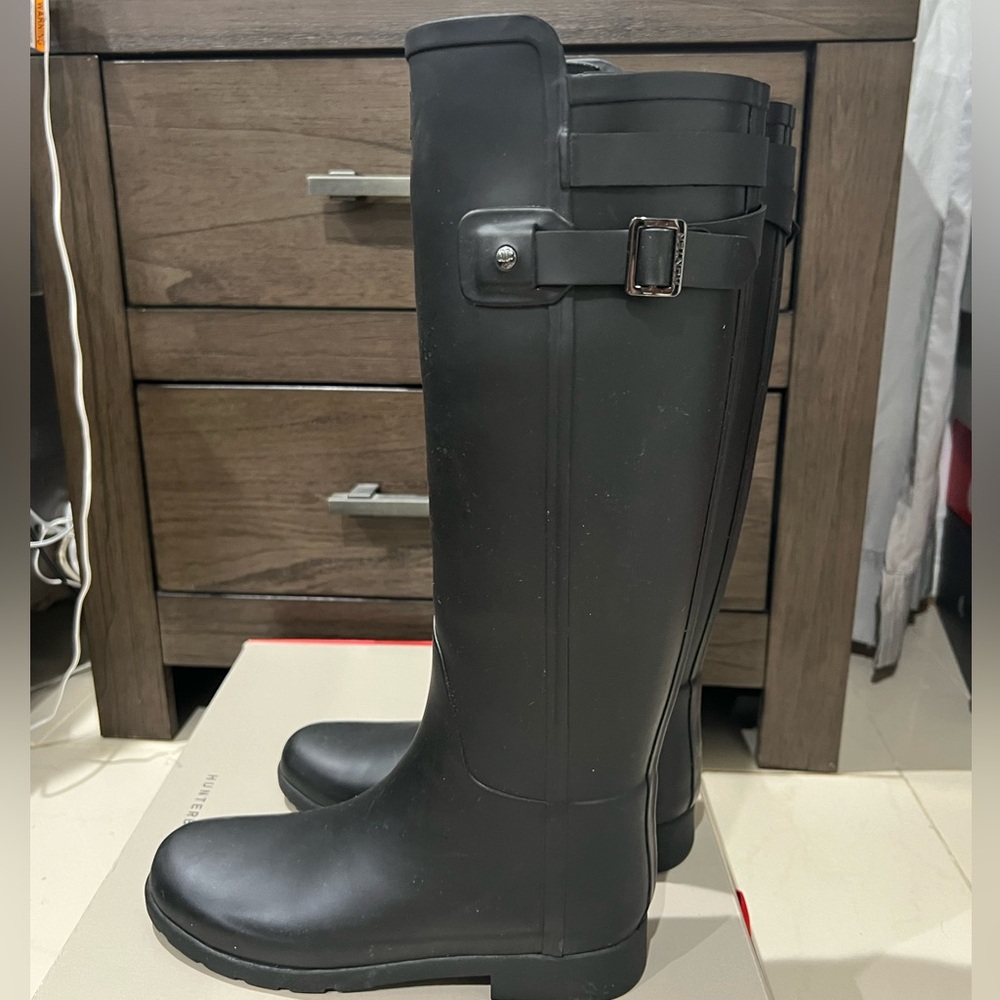 Black tall hunter boots
